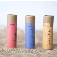 View: Three kraft cardboard lip balm tubes with pink, blue and cream wrap labels and printed safety seals
