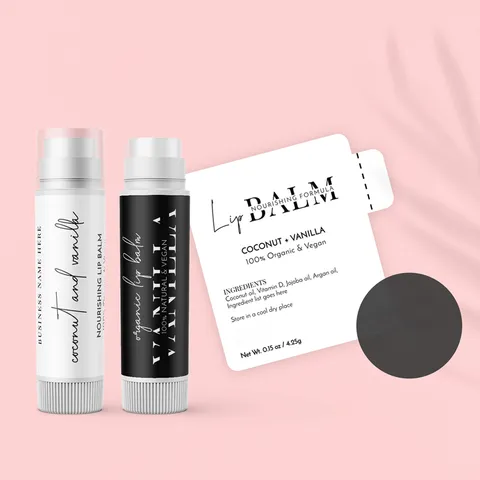 Two lip balm tubes in white and black next to a printed vanilla lip balm label showing an ingredient panel