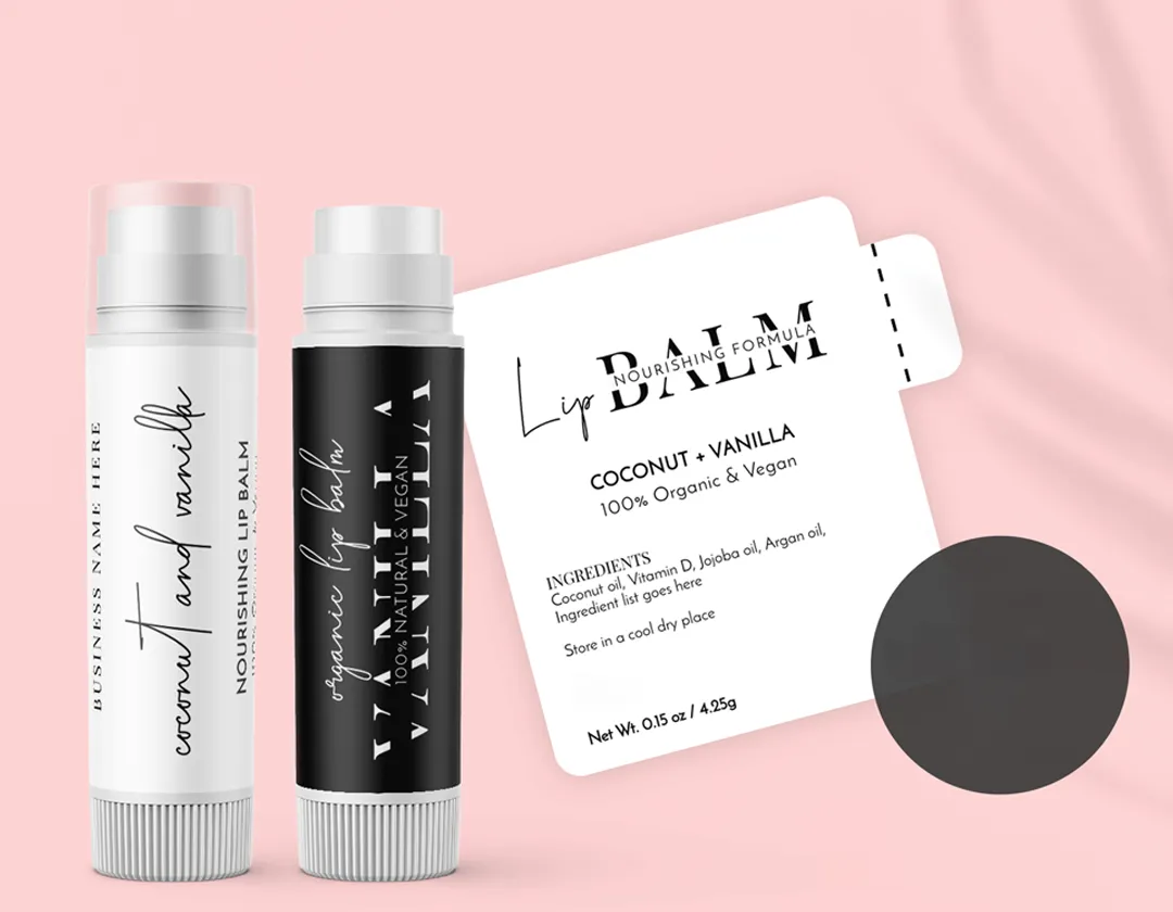Printed lip balm label showing a full ingredient panel beside two lip balm tubes