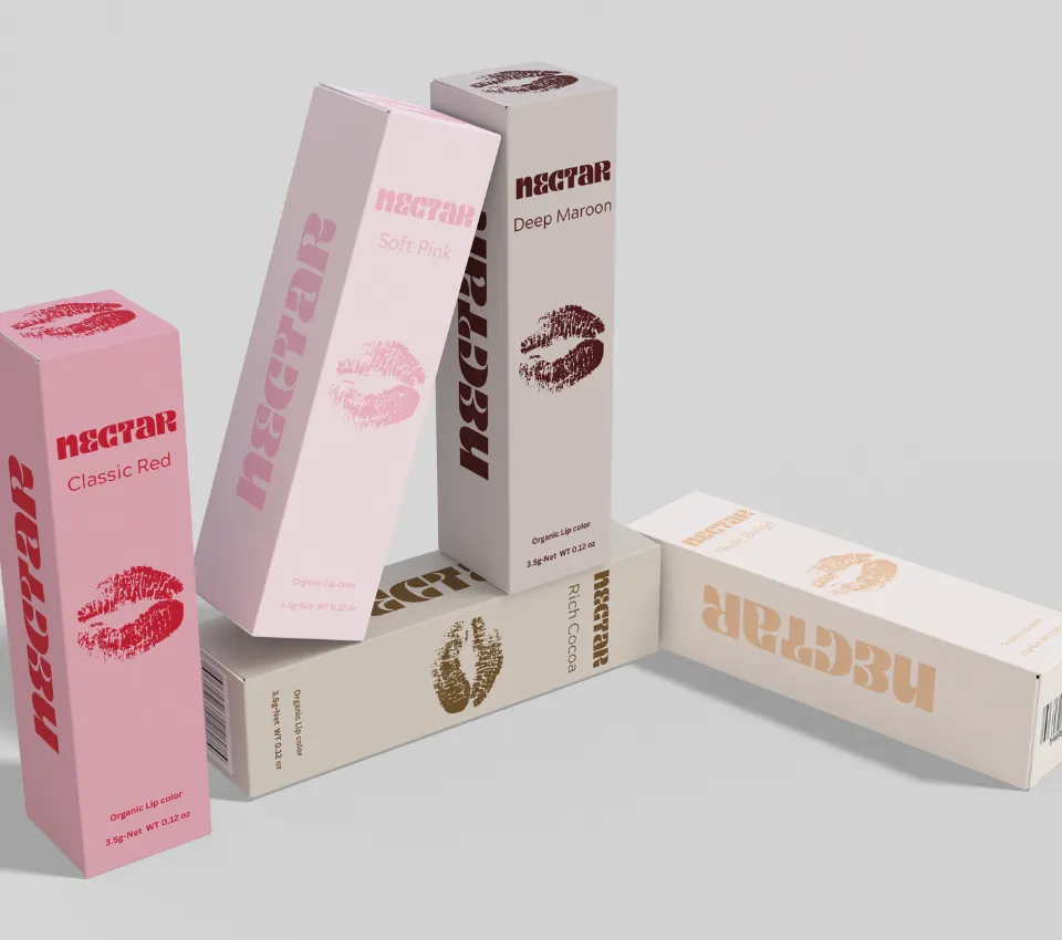 A range of pink and nude lip care cartons standing and lying together
