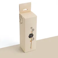 View: Tall cream lip balm box with a hanging tab and a single-line rose illustration on the front panel