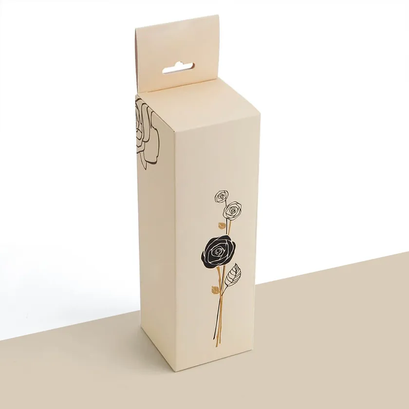 Tall cream lip balm box with a hanging tab and a single-line rose illustration on the front panel