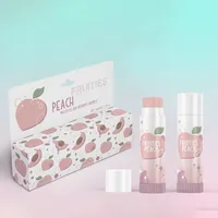 View: Peach printed lip balm carton lying flat with two matching lip balm tubes standing beside it