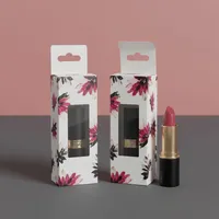 View: Two floral printed hang tab lipstick boxes with windows standing beside a black and gold lipstick