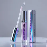 View: Silver mirror finish lip gloss box with reversed type beside a lilac gloss tube and its applicator