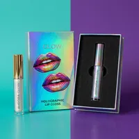 View: Open holographic rigid box with a black foam insert holding a single lip gloss tube