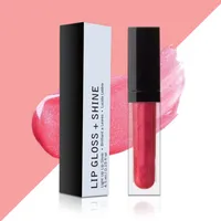 View: Tall slim black and white lip gloss box standing beside a clear gloss tube with a black cap