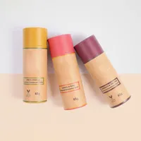 View: Three larger format paperboard balm sticks in yellow, pink and mauve with printed ingredient panels