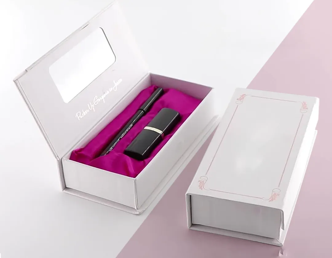 Open rigid lipstick box with a lipstick seated in a satin-lined fitted tray